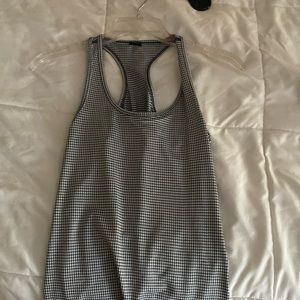 Checkered kind of tank top from dancer company pretty long but in good condition